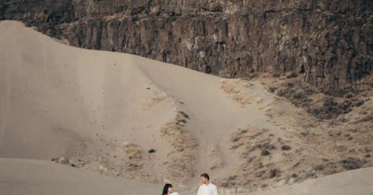 Romantic Day Trip - Young couple enjoying vacation in desert