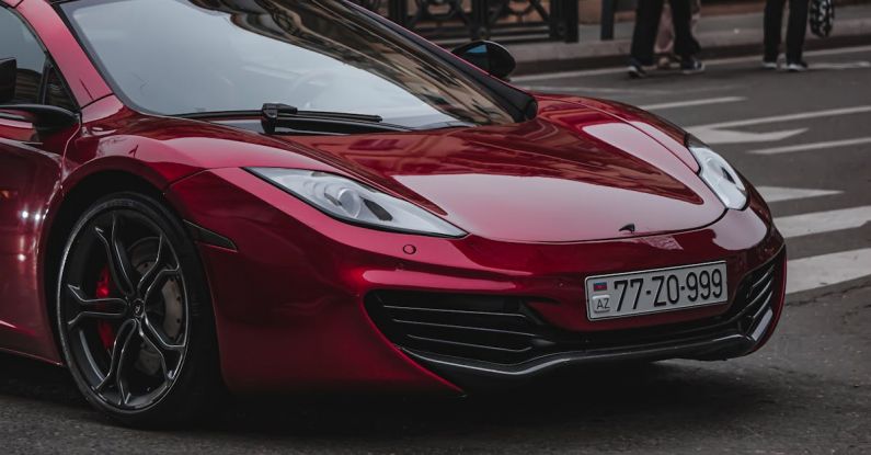 Coastal Drive - A red mclaren car is parked on the street
