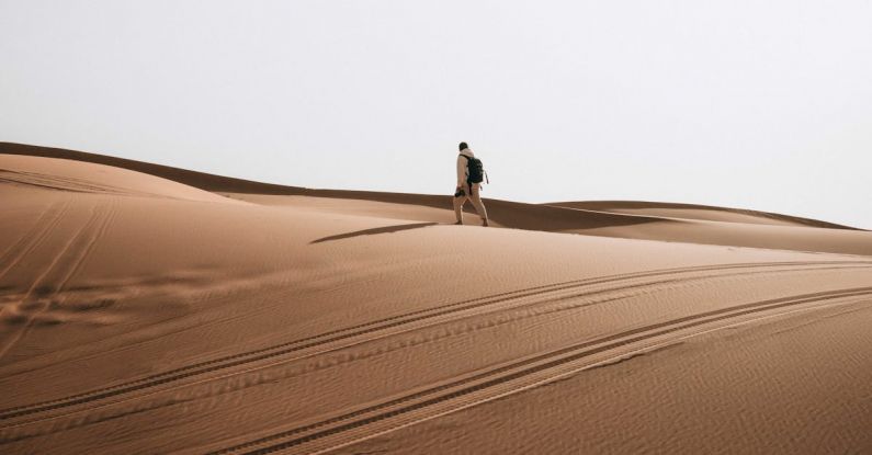 Hiking Trails - Man Hiking in Desert
