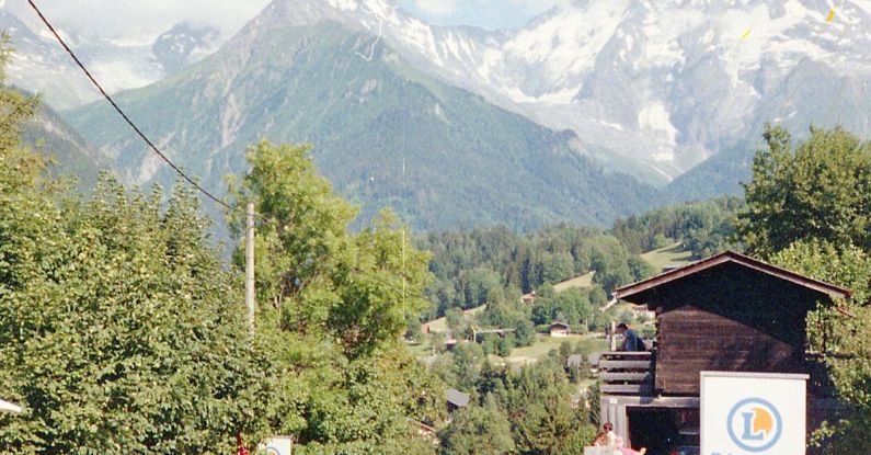 Crowded Trails - A Crowded Street with Mountains in the Background