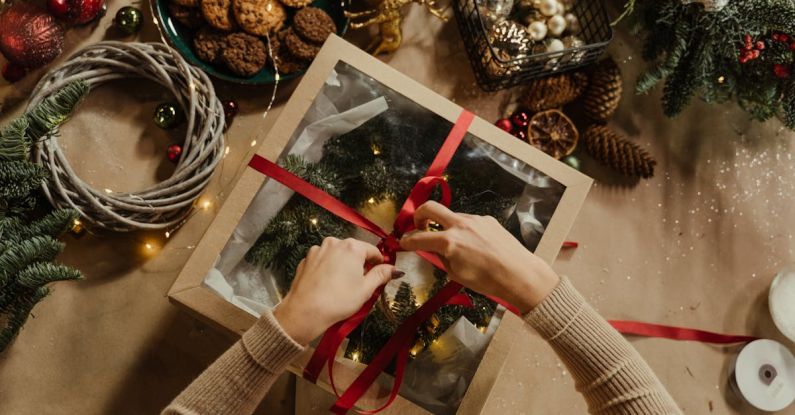 Festival Packing - Top View of Woman Packing a Christmas Present