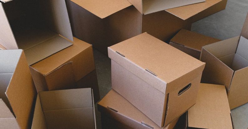 Pack Light - Stack of empty cardboard boxes prepared for relocation from home